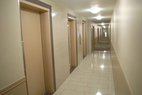 99 & 670 - Carpeted Hallway with elevator landing